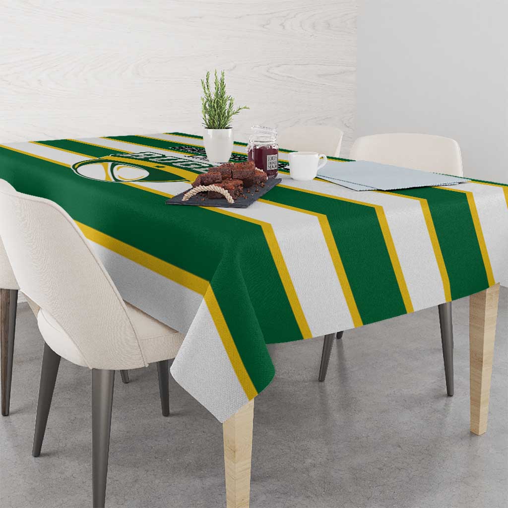 Green and yellow striped rugby tablecloth with centerpiece on dining table