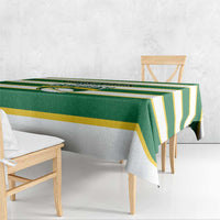 Green and yellow striped rugby tablecloth draped on wooden benches