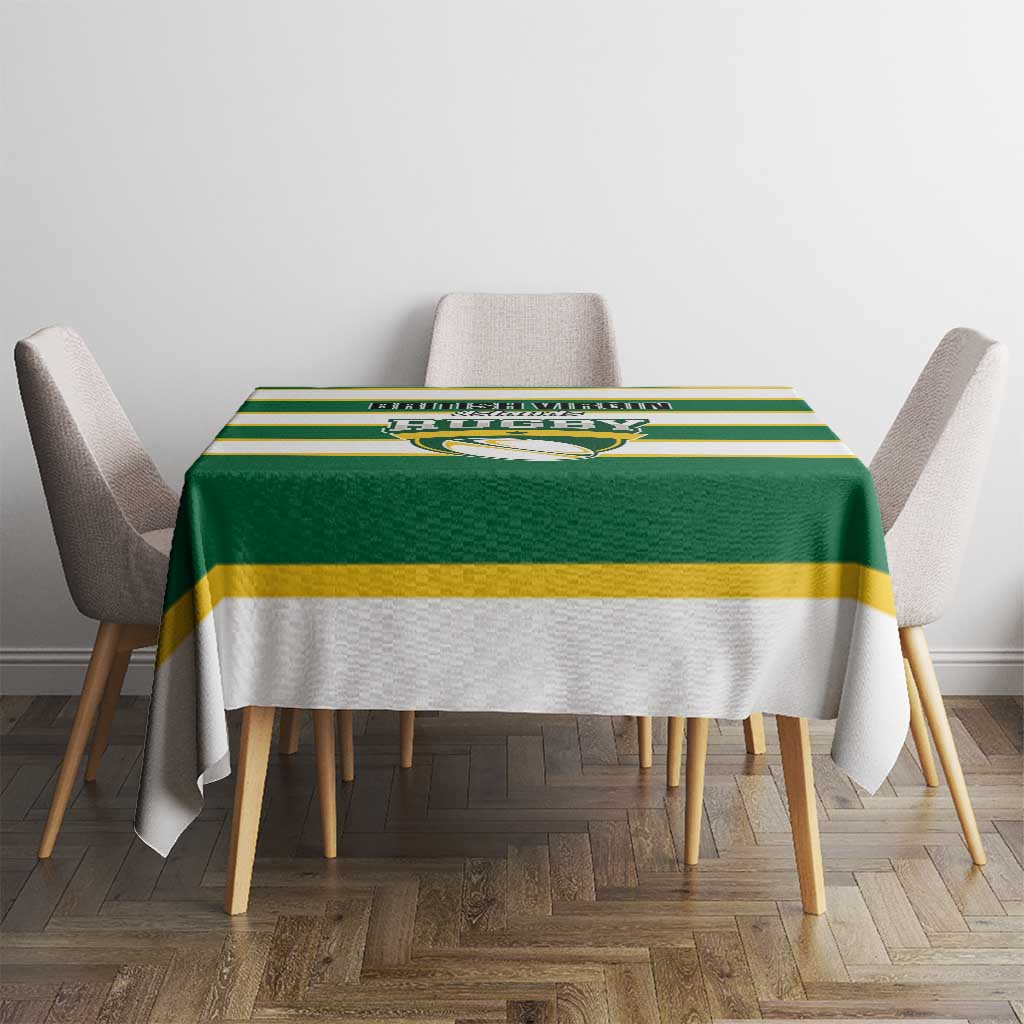 Green and yellow striped rugby tablecloth on round dining table with four chairs