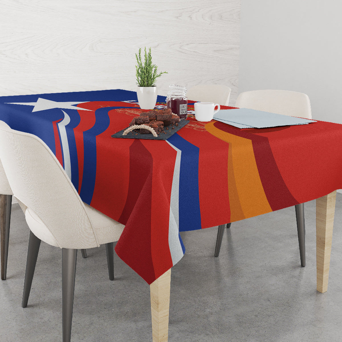 Red Chile football tablecloth with blue and gold vertical stripe pattern on dining table