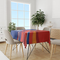 Red Chile football tablecloth with blue star stripe design on dining table with chairs
