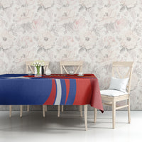 Red Chile football tablecloth with blue and red stripe pattern on console table