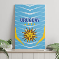 Blue canvas wall art with URUGUAY text, stars, and sun crest, upright view