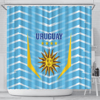 Blue shower curtain with Uruguay banner, three stars, and sun-and-shield graphic