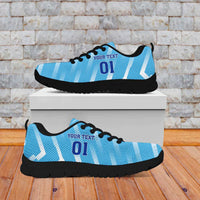 Light blue football sneakers with white pattern, black sole, top and side views