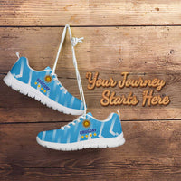 Light blue football sneakers with Uruguay crest logo, white sole and side angle