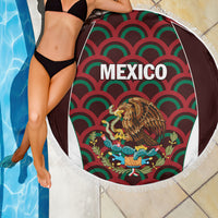 Round fringed beach blanket close-up with Mexico text and eagle graphic