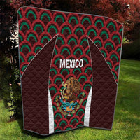 Mexico football quilt showing quilted texture, dark brown with green/red fan pattern and shield