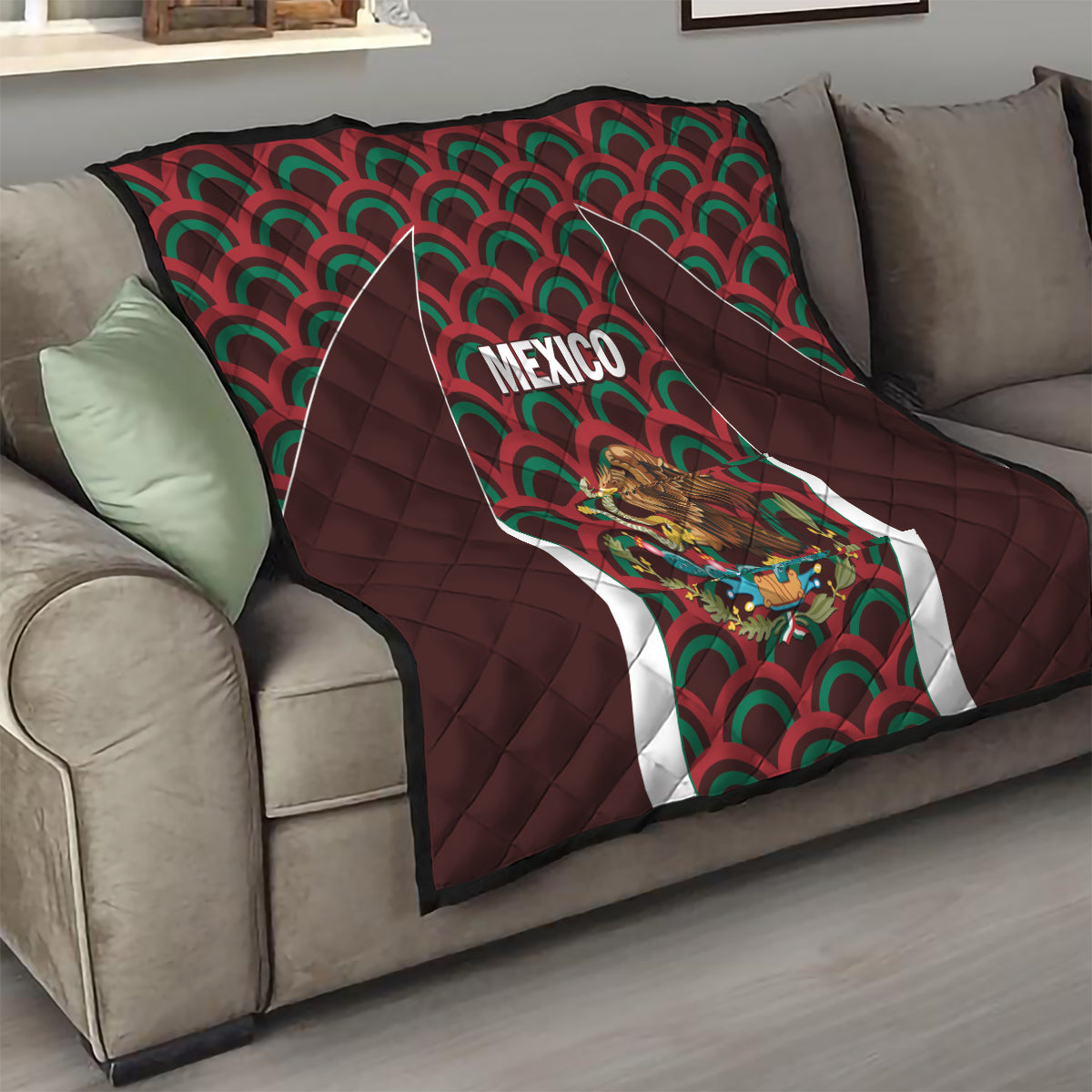 Mexico football quilt on sofa with dark brown quilted border, green/red fan pattern and crest