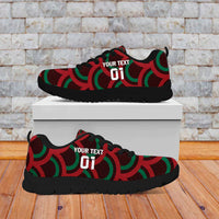 Red, green, and black low-top sneakers with Mexico logo, lace-up, black sole on box