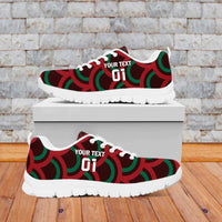 Red, green, and black low-top sneakers with Mexico logo, lace-up, white sole on box