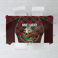 Maroon tablecloth with colorful Mexico emblem graphic and geometric wave pattern center