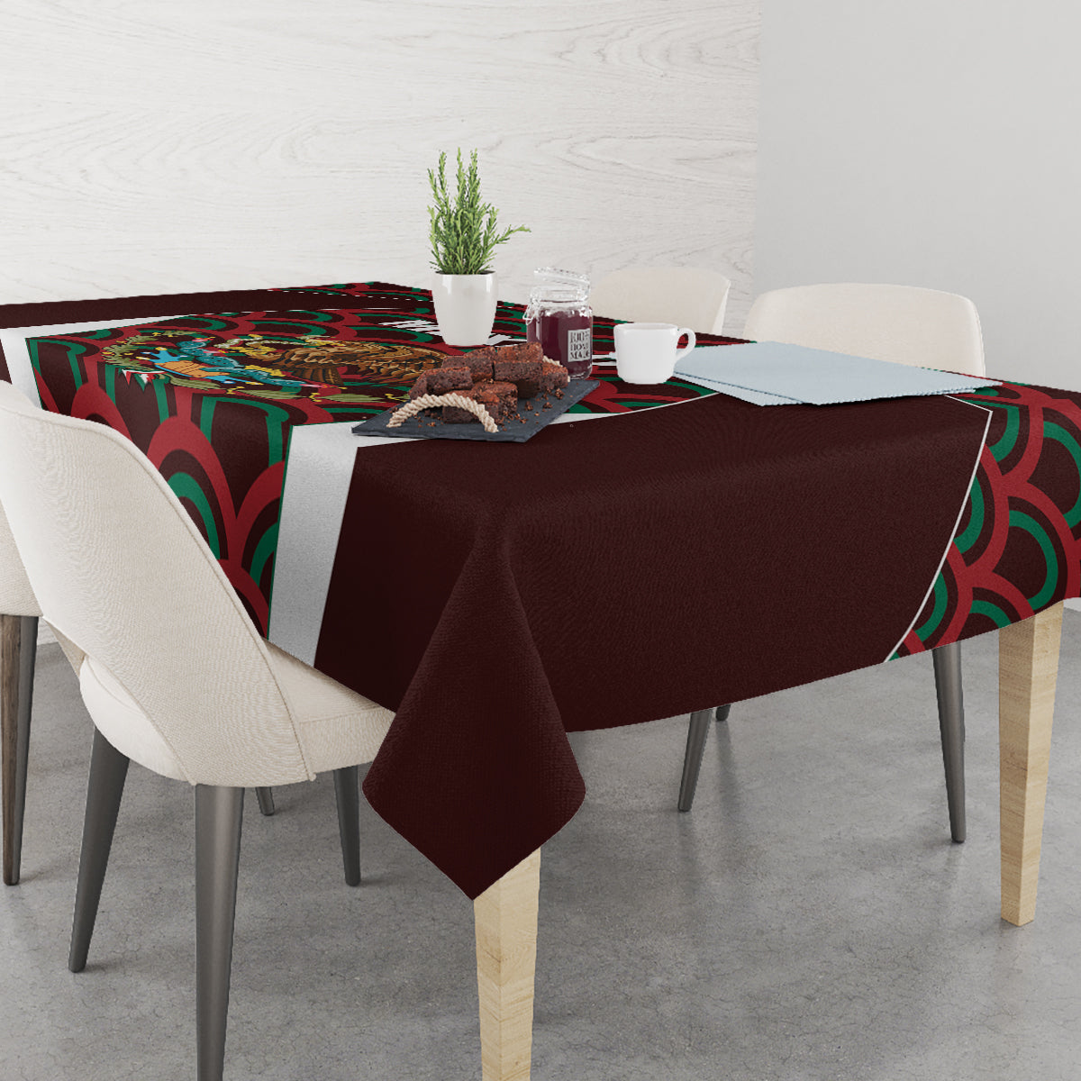 Maroon tablecloth with corner drape and colorful Mexico emblem and wave pattern