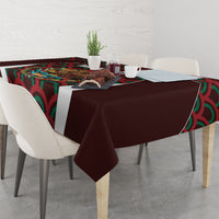 Maroon tablecloth with corner drape and colorful Mexico emblem and wave pattern
