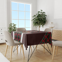 Maroon tablecloth on dining set with colorful Mexico emblem panel and wave pattern