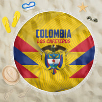 Round yellow beach blanket with Colombia Los Cafeteros crest, blue and red stripes, white fringe