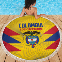 Round yellow beach blanket with Colombia Los Cafeteros text and crest, bordered by white fringe