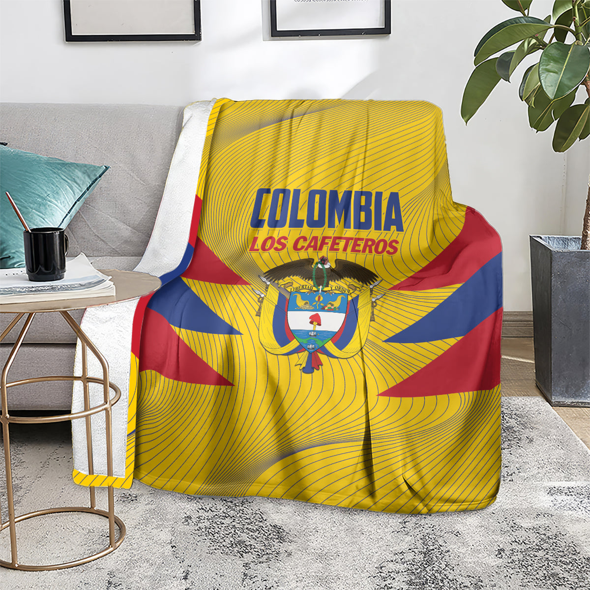 Colombia football blanket on chair, yellow print with blue/red diagonals and central crest