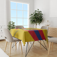 Yellow Colombia football tablecloth on dining table with blue-red stripe panel in center