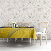 Yellow Colombia football tablecloth with chevron stripes and crest, on dining table set