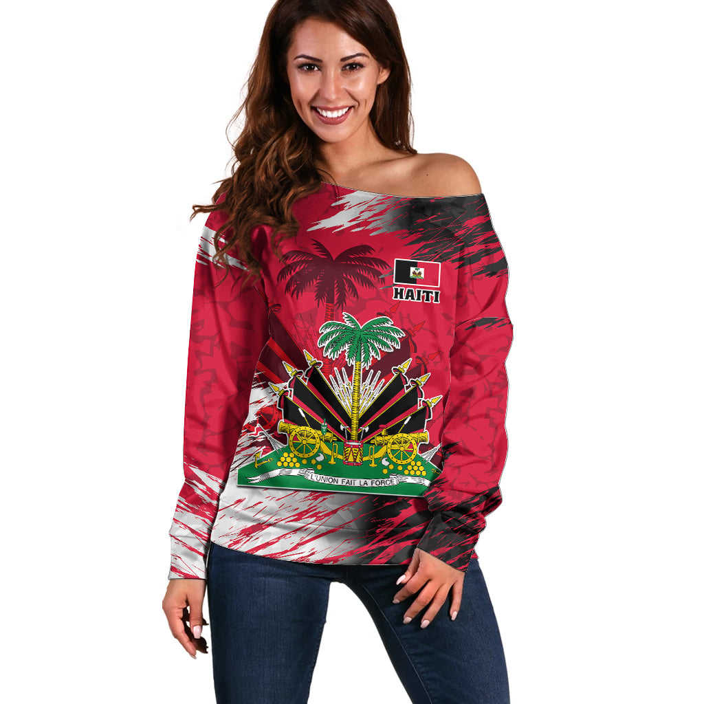 Women’s red off-shoulder sweater with Haiti coat of arms and flag graphic at chest