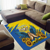 Blue and yellow area rug with raised gold dove, large blue wings, and sunflowers