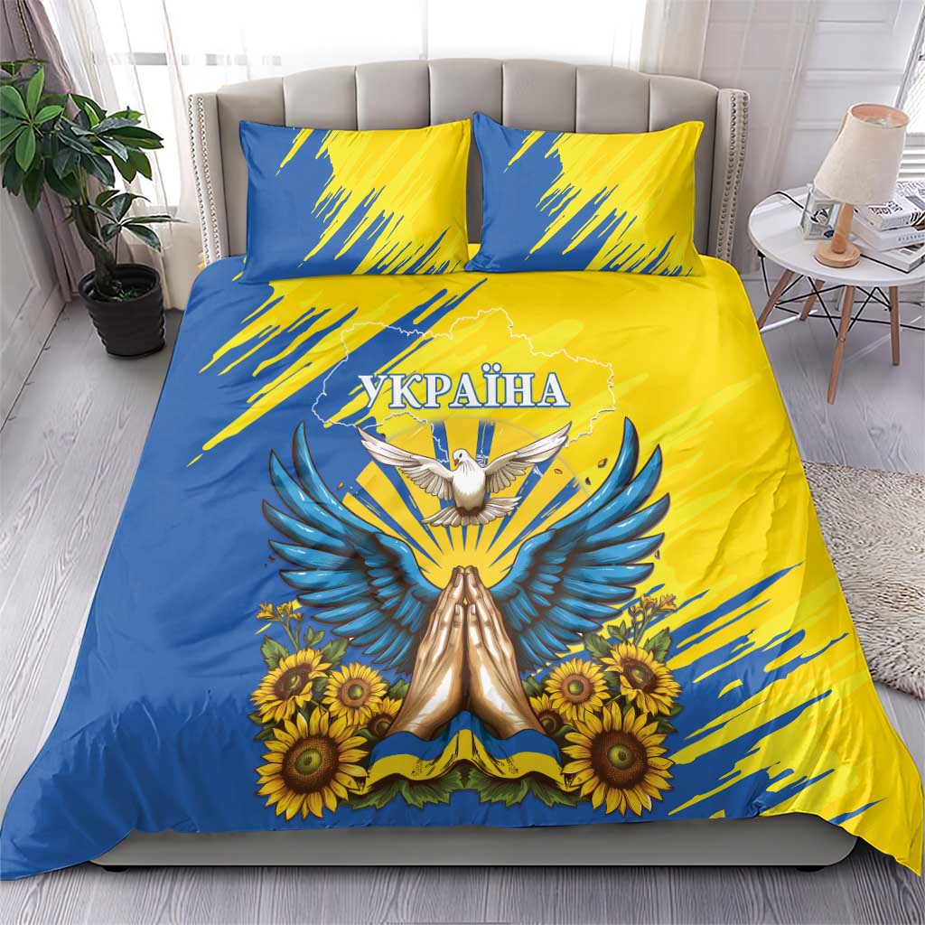 Blue and yellow duvet and pillowcases with dove, sunflowers, and centered crest