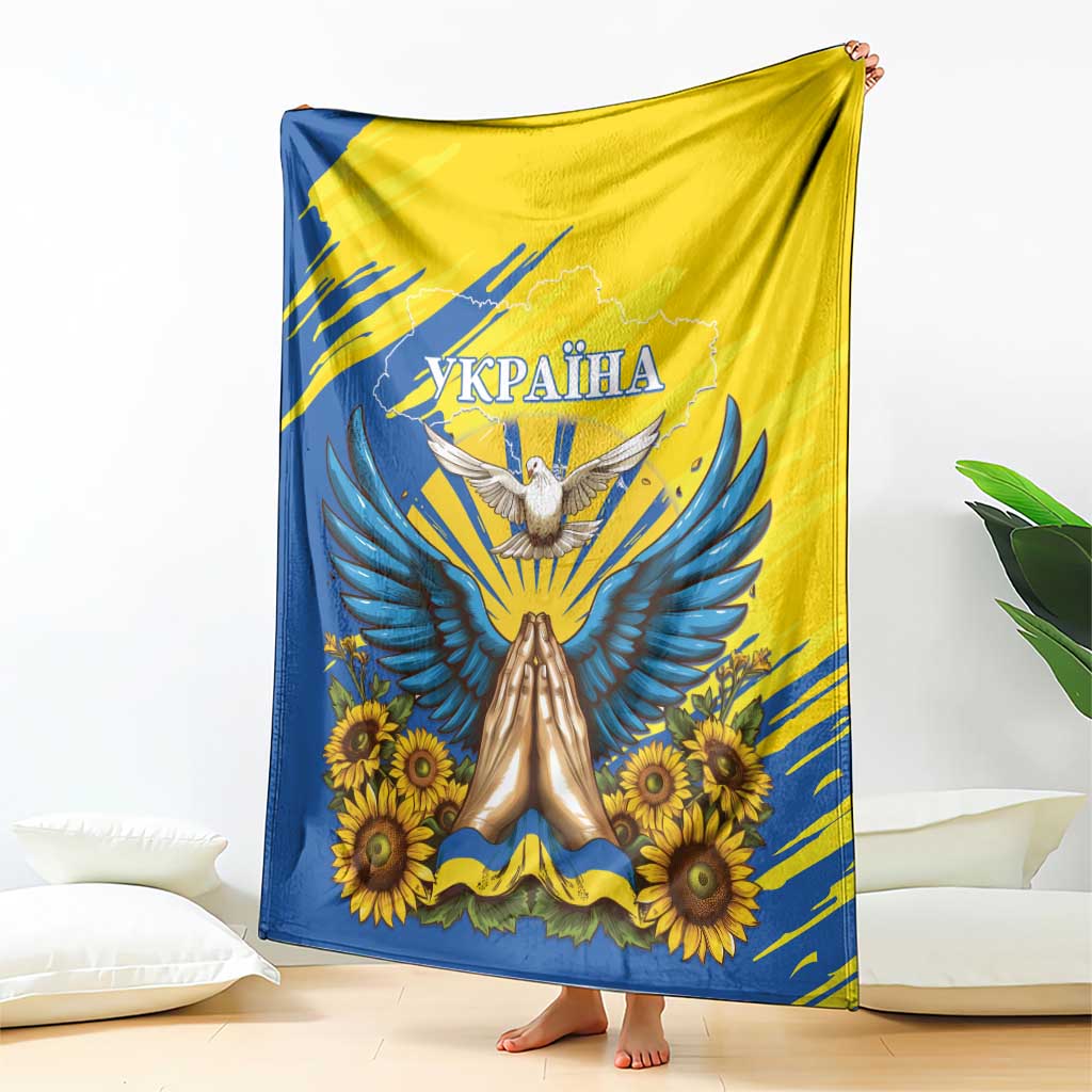 Blue and yellow Ukraine graphic blanket featuring dove, sunflowers, and banner text