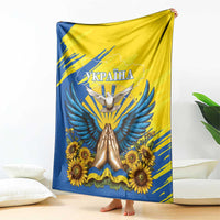 Blue and yellow Ukraine graphic blanket featuring dove, sunflowers, and banner text