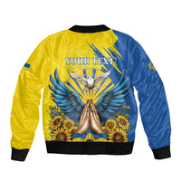 Unisex blue and yellow bomber jacket, back view, large dove wings and sunflower print