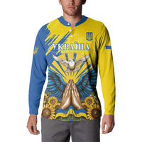 Yellow and blue long-sleeve button sweatshirt with dove and trident emblem, sunflower graphics