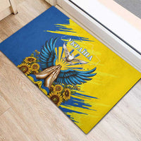 Diagonal view: blue and yellow rubber doormat with dove, Ukraine text, and sunflowers