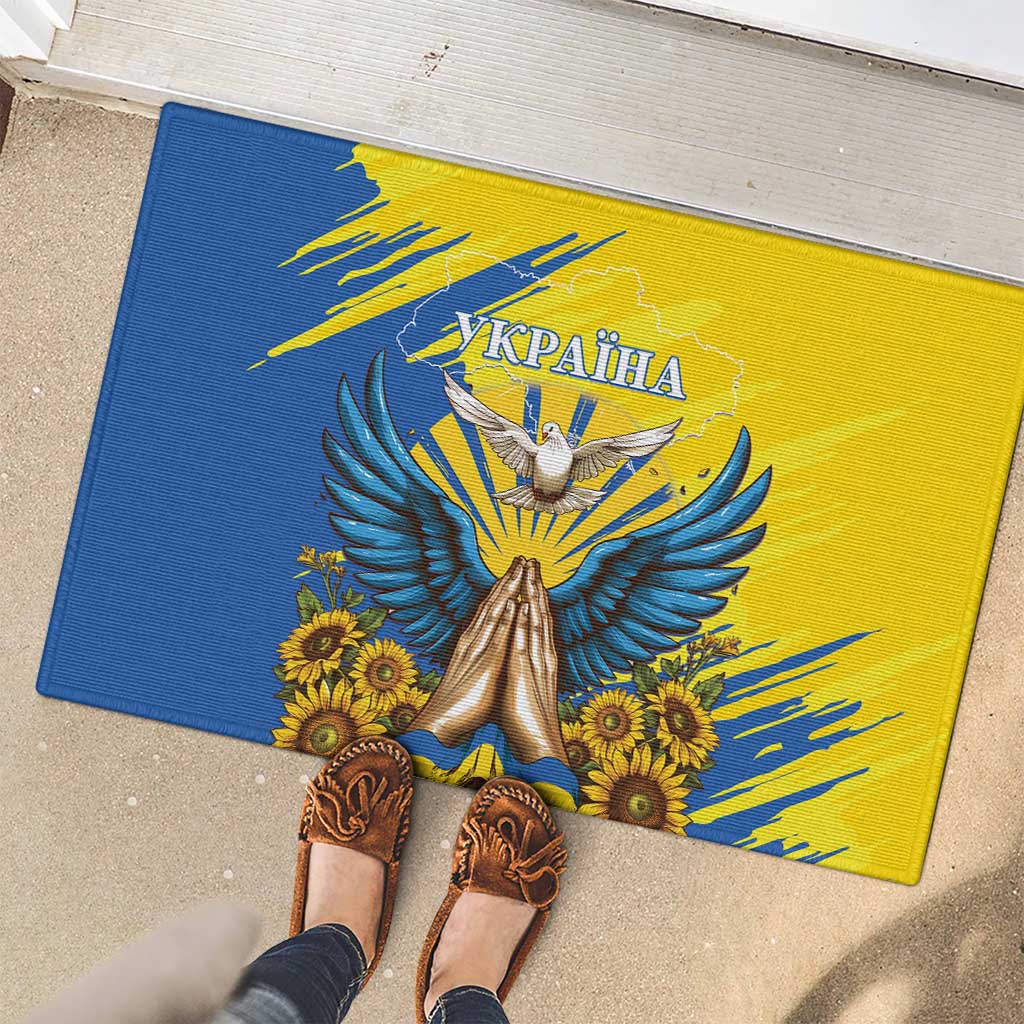 Blue and yellow rubber doormat with dove artwork and sunflowers; centered Ukraine text