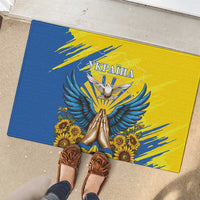Blue and yellow rubber doormat with dove artwork and sunflowers; centered Ukraine text