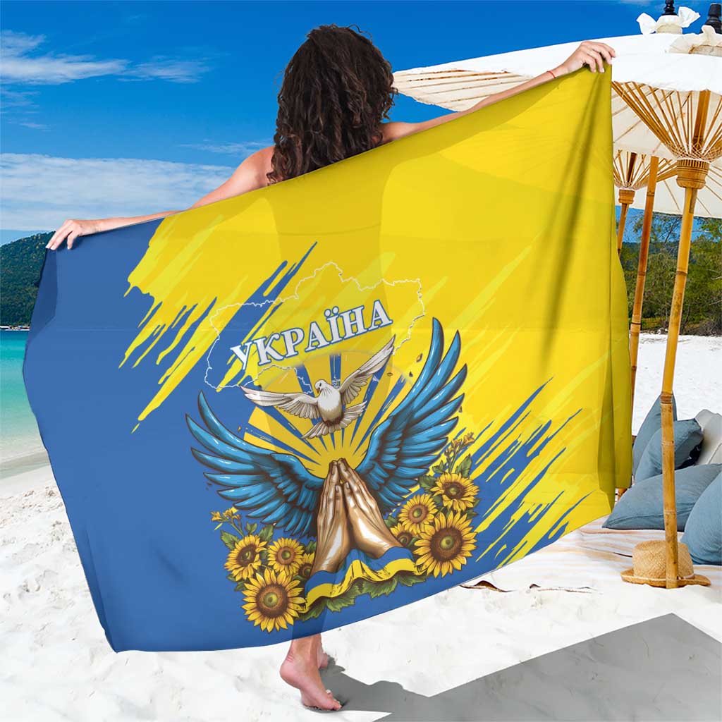 Blue and yellow Ukraine-themed sarong with dove, sunflower, and bold emblem print