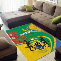 Rectangular area rug with green, yellow and blue curved motif and black animal silhouettes