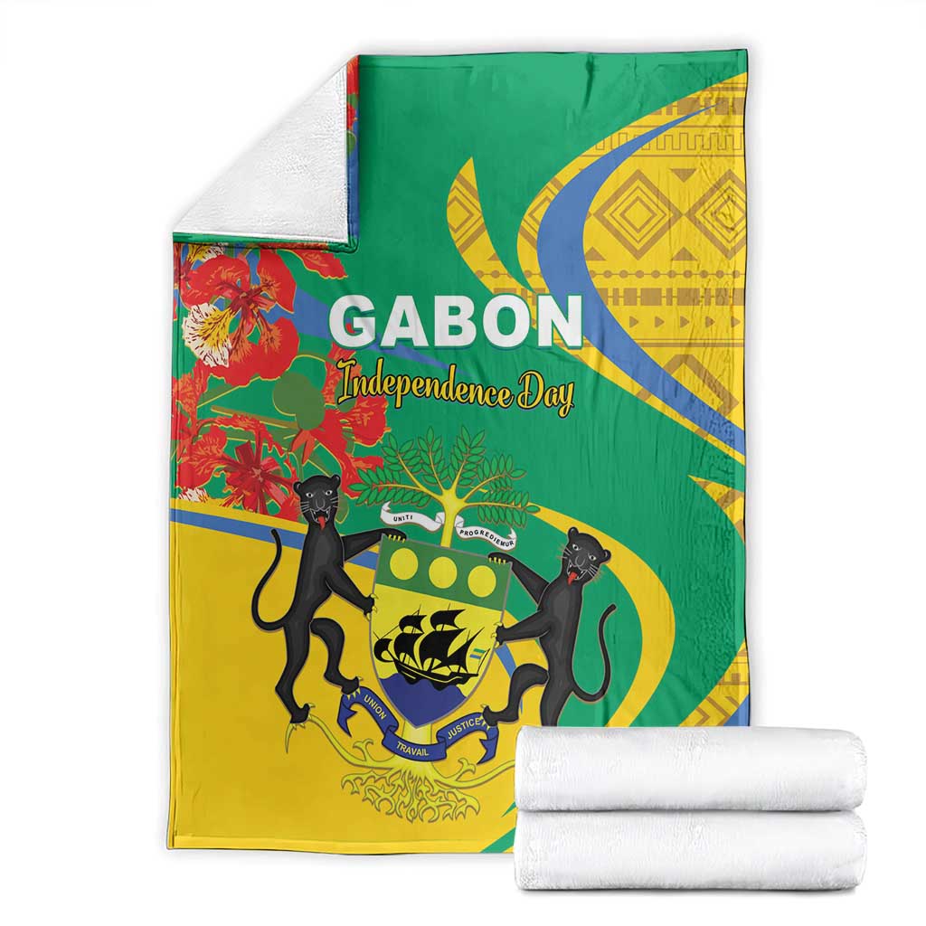 Folded Gabon independence day blanket in green and yellow with blue corner pattern and animals