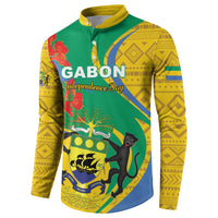 Green button sweatshirt with yellow patterned sleeves, Gabon emblem and animal graphic