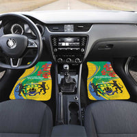 Two green-and-yellow car floor mats with Gabon text and lion crest by gear area