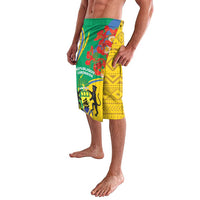 Green and yellow patterned lavalava wrap skirt with floral and emblem graphics