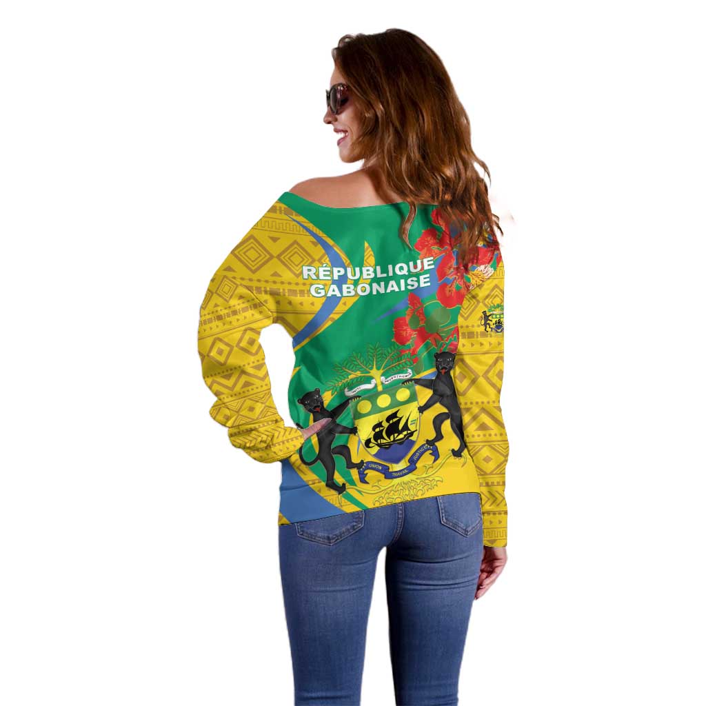 Off-shoulder sweater in green and yellow with emblem print, long sleeves (back view)