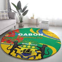 Round green rug with yellow border, black cats around central tree emblem