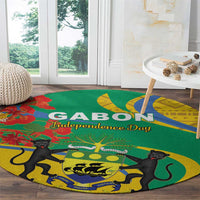 Round green rug with yellow border, black cats and decorative emblem with text
