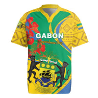 Green rugby jersey with yellow trim, Gabon emblem, cats and red floral print