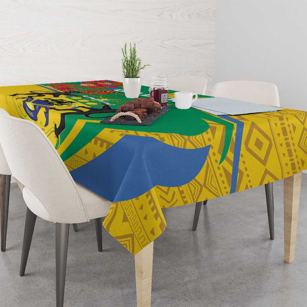 Patterned rectangular tablecloth with yellow, blue, and green geometric and animal motifs