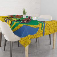 Patterned rectangular tablecloth with yellow, blue, and green geometric and animal motifs