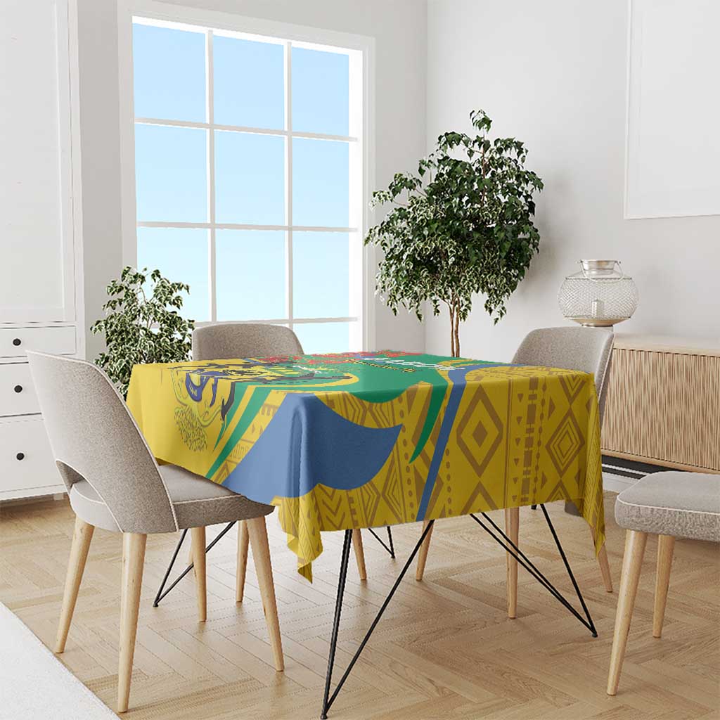 Patterned tablecloth with green, blue, and yellow geometric and animal motifs