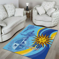 Blue rectangular rug with golden sun emblem, “25 August” text, and silhouette graphics