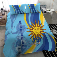 Blue bedding set with sun emblem and 25 August, matching pillowcases in wave stripes