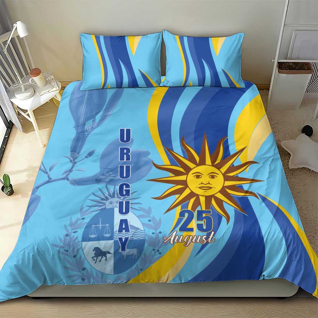 Blue bedding set on bed with sun emblem and 25 August graphic, two pillowcases
